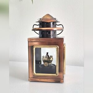 Copper and gold-colored metal lantern